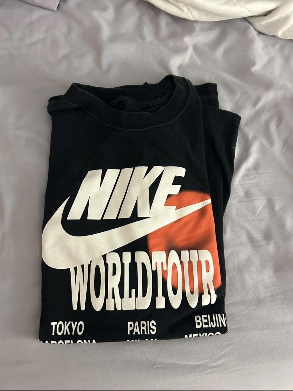 Nike Black Tee with White Logo and Orange Accent